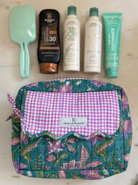block printed cosmetics bag with 4 large bottles
