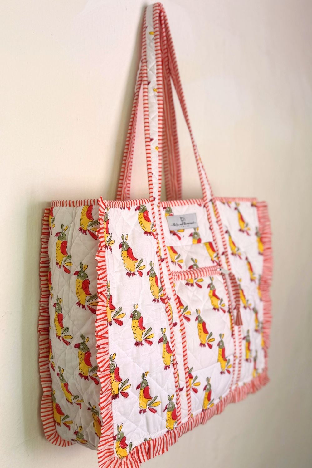 side view of block printed quited bag with ruffles