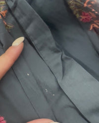black fabric with tiny white spots
