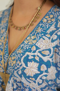 detail of gold print and birds - The Fox and the Mermaid