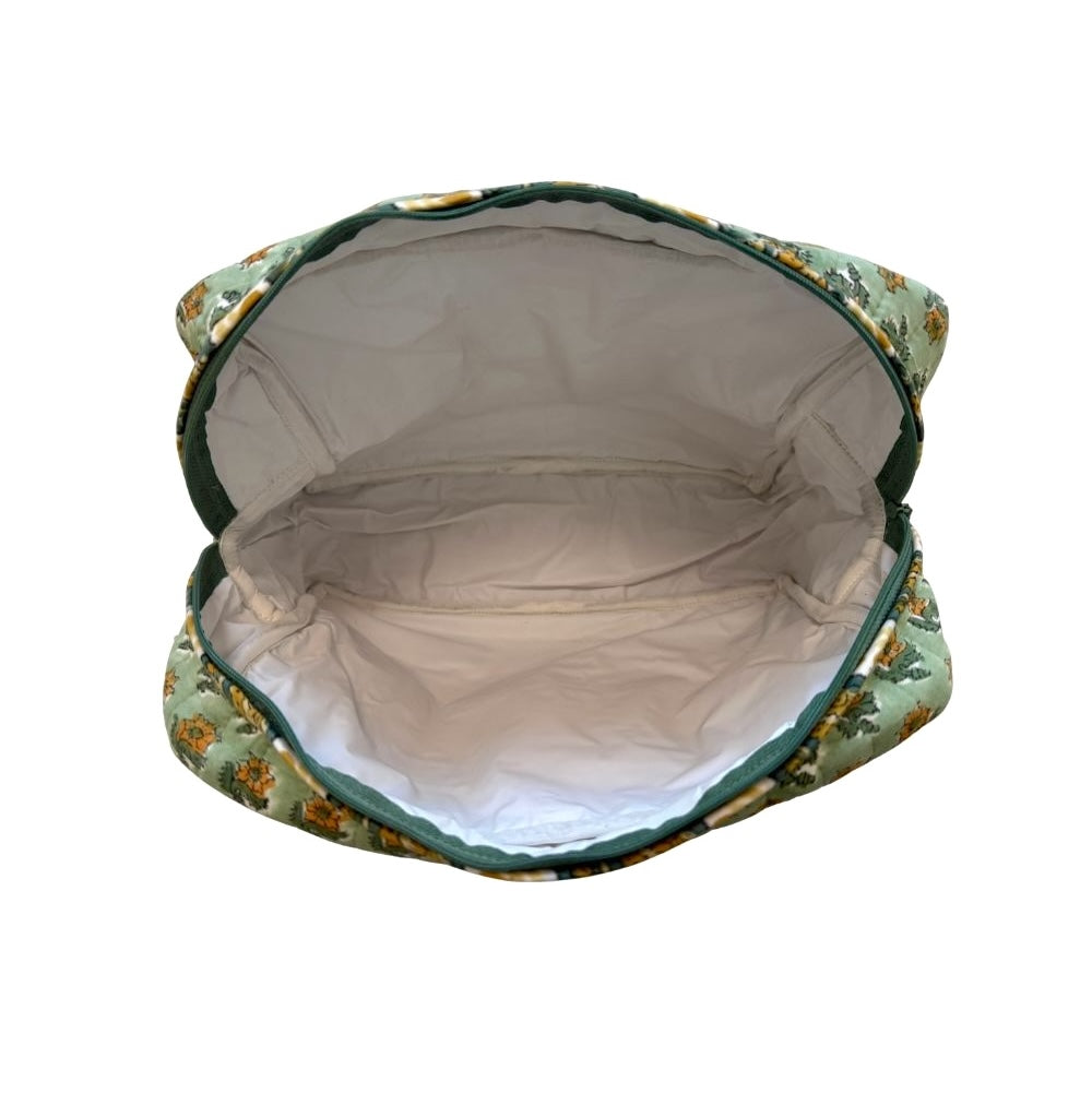 Waterproof plastic-lined interior of quilted block print makup travel bag