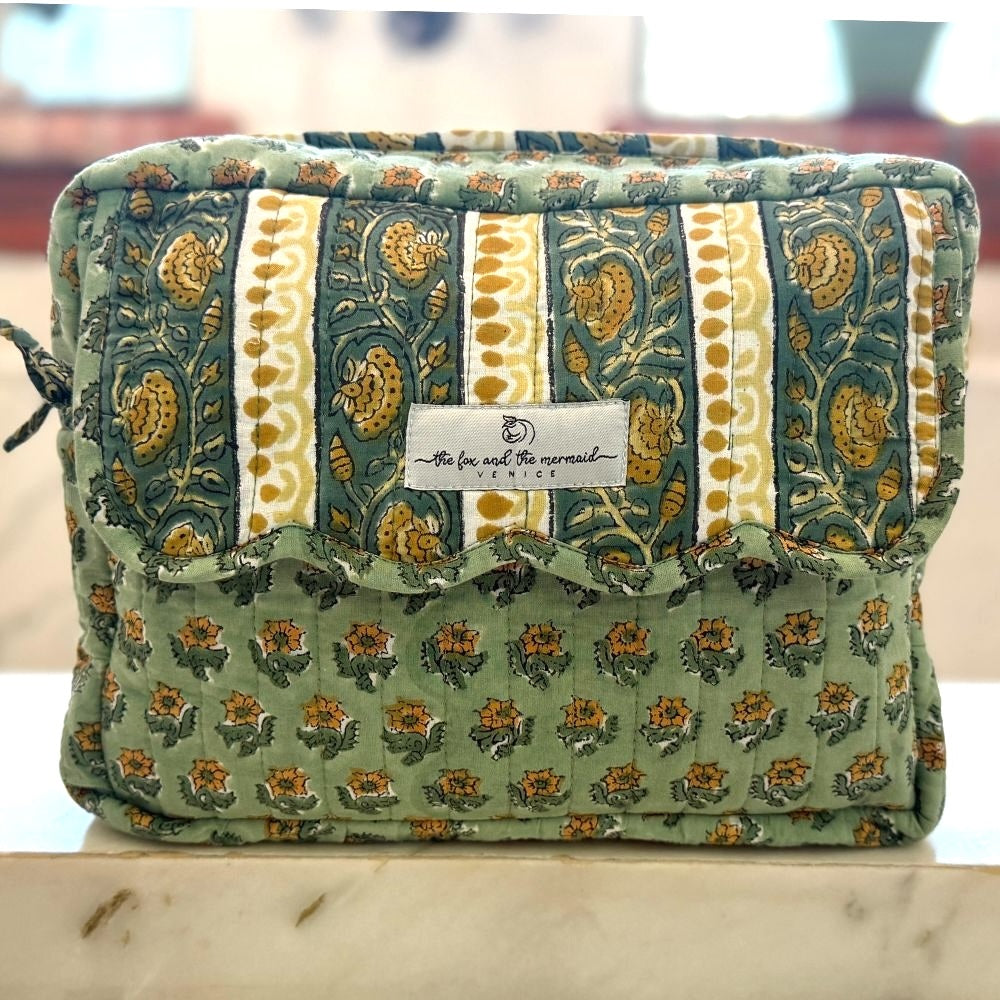 block printed green travel bag with scalloping and ties