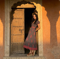 black and pink maxi dress with belt and smocked chest
