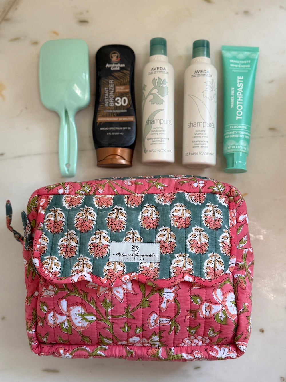 orange hand block printed cosmetic bag set showing large size fits full-size toiletries