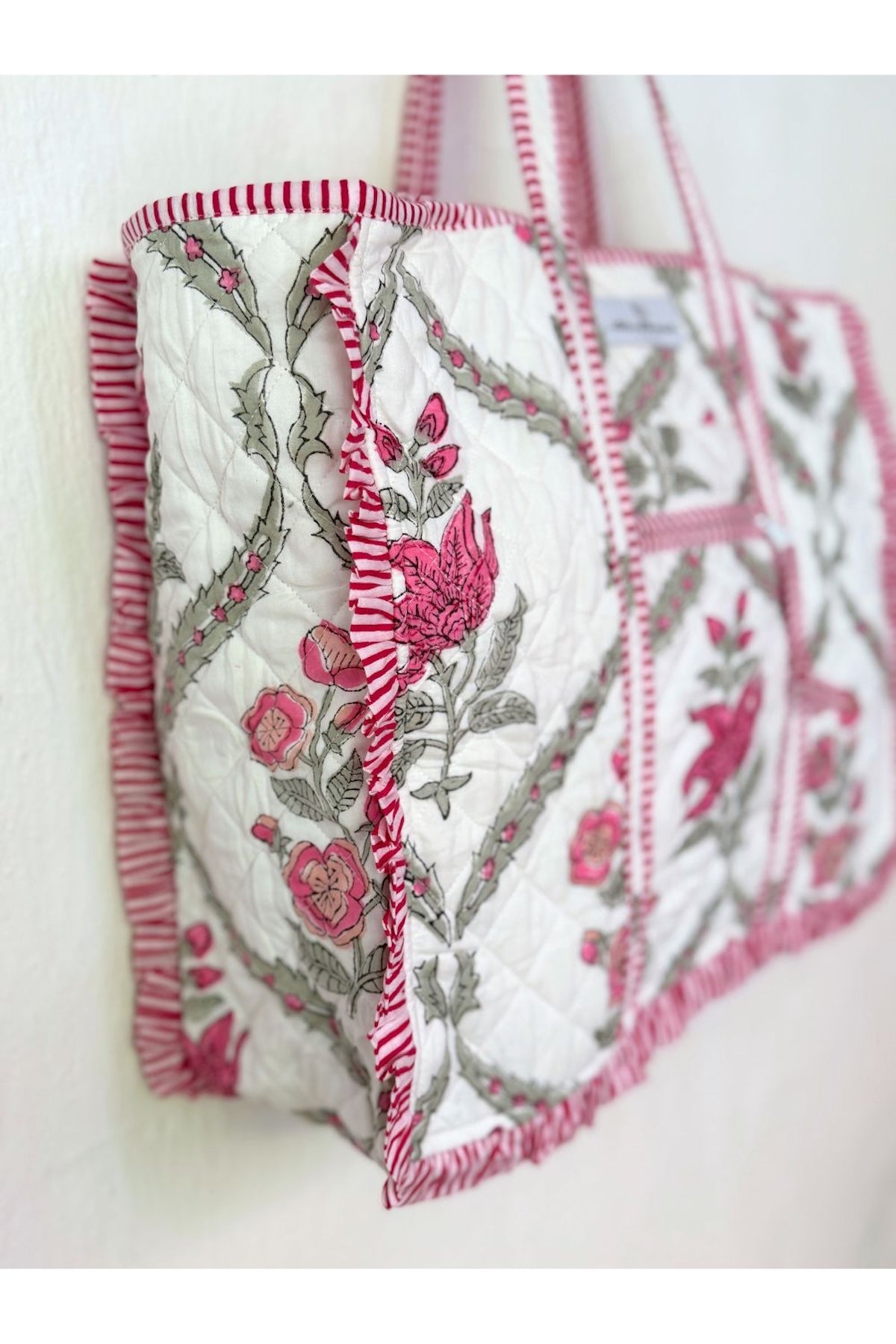 ruffles on the edges of pink and white block printed tote
