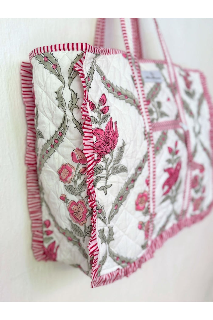 ruffles on the edges of pink and white block printed tote