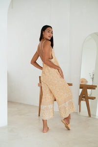 pastel yellow floral rayon jumpsuit with cropped legs and straps
